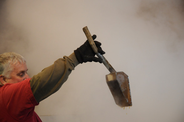 Steve Glabach demonstrating how the syrup thickens and comes off the spoon in a sheet